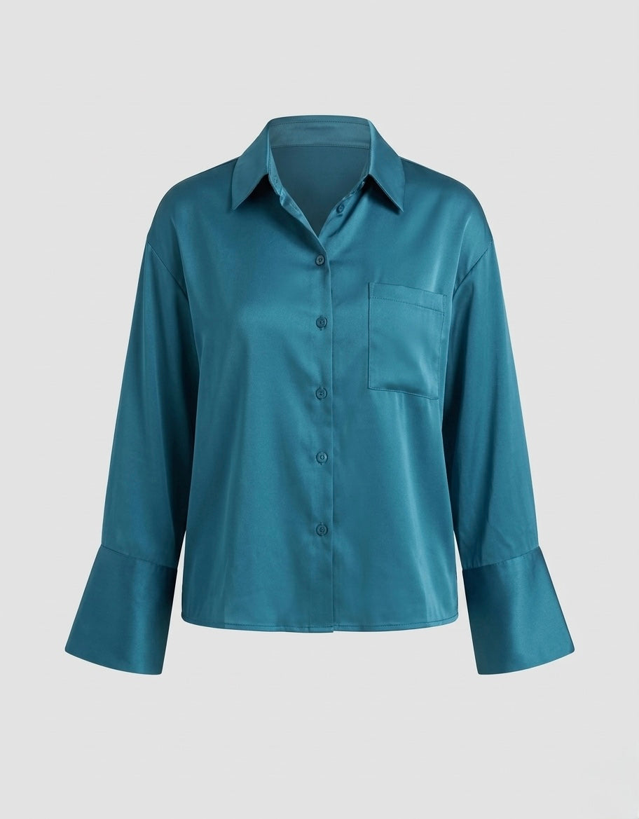 Teal shirt on a light gray background